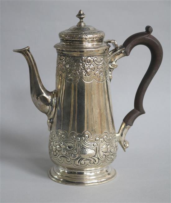 An Edwardian embossed silver cafe au lait pot by Charles Stuart Harris & Sons, London, 1905, gross 12.5 oz.